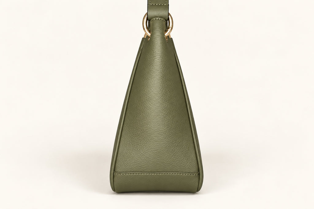 An elegant shoulder bag with a clean, understated silhouette and a sophisticated sage-green finish. Designed with gold-tone detailing, a comfortable shoulder strap and a spacious, compartmentalised interior for effortless everyday organisation.