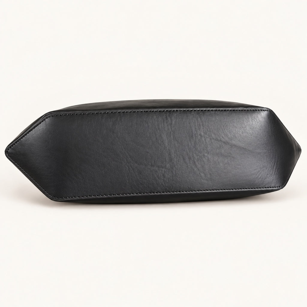 A black leather clutch or small handbag shown from the bottom side, featuring a smooth texture and stitched edges, set against a plain off-white background.